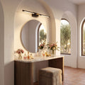 Black and Gold Acrylic Tube LED Vanity Wall Light above the mirror of a dressing table