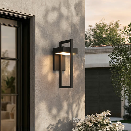 Black frame outdoor wall sconce glowing beside a glass door on a rendered wall