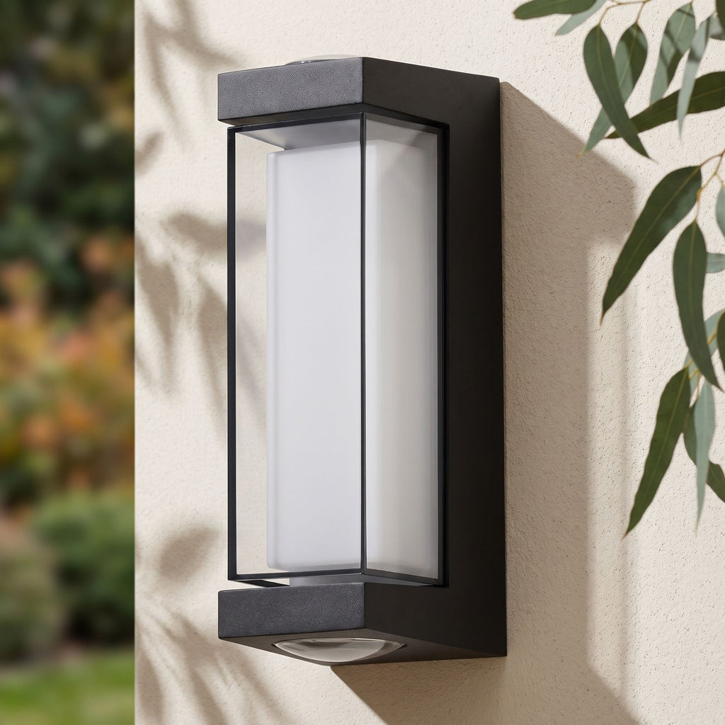 Black Up Down Outdoor Wall Light on a rendered wall, angled close view