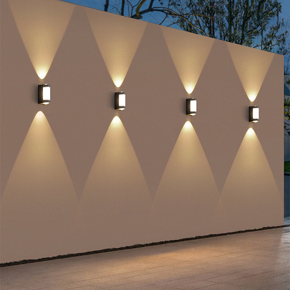 Row of up down outdoor wall lights along a long exterior wall