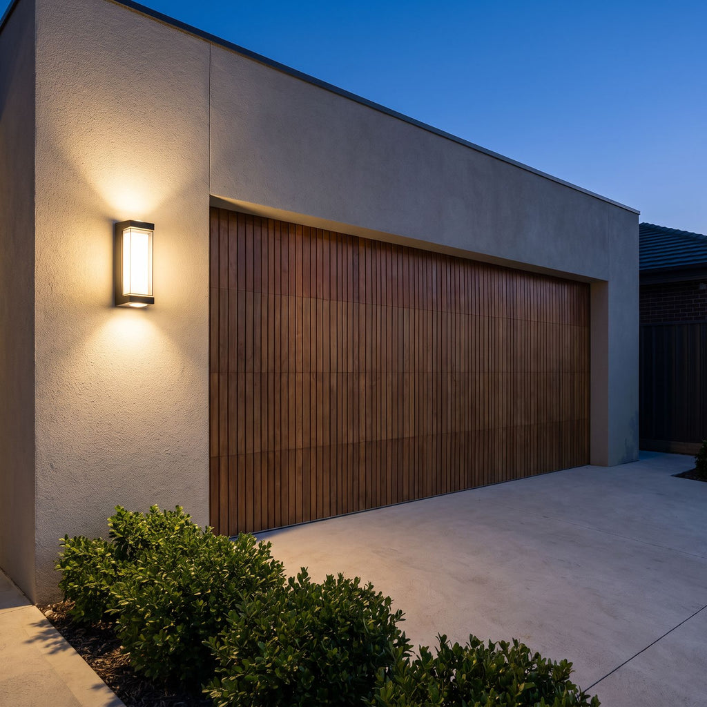 Black Up Down Outdoor Wall Light beside a timber garage door