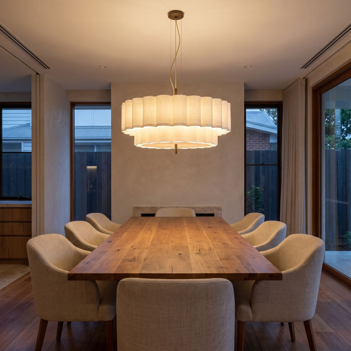 Boho Knitted Fabric Ripple Pendant Light above a timber dining table