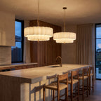 A pair of Boho Knitted Fabric Ripple Pendant Lights over a stone kitchen island