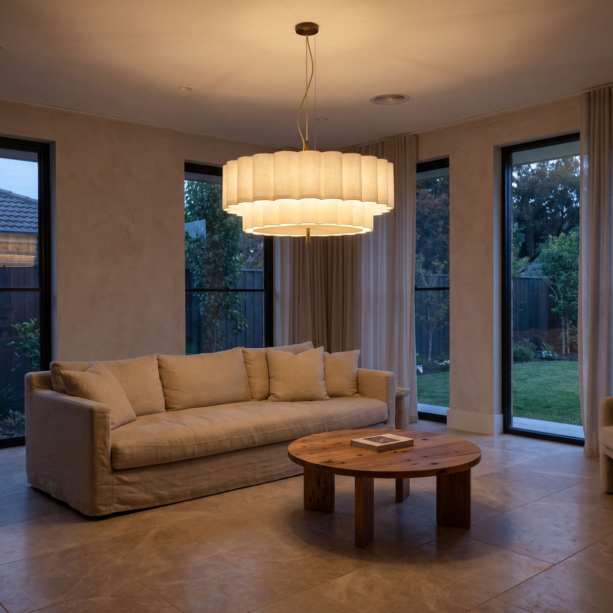 Boho Knitted Fabric Ripple Pendant Light above a linen sofa in a living room