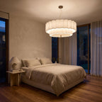 Boho Knitted Fabric Ripple Pendant Light centred above a bed
