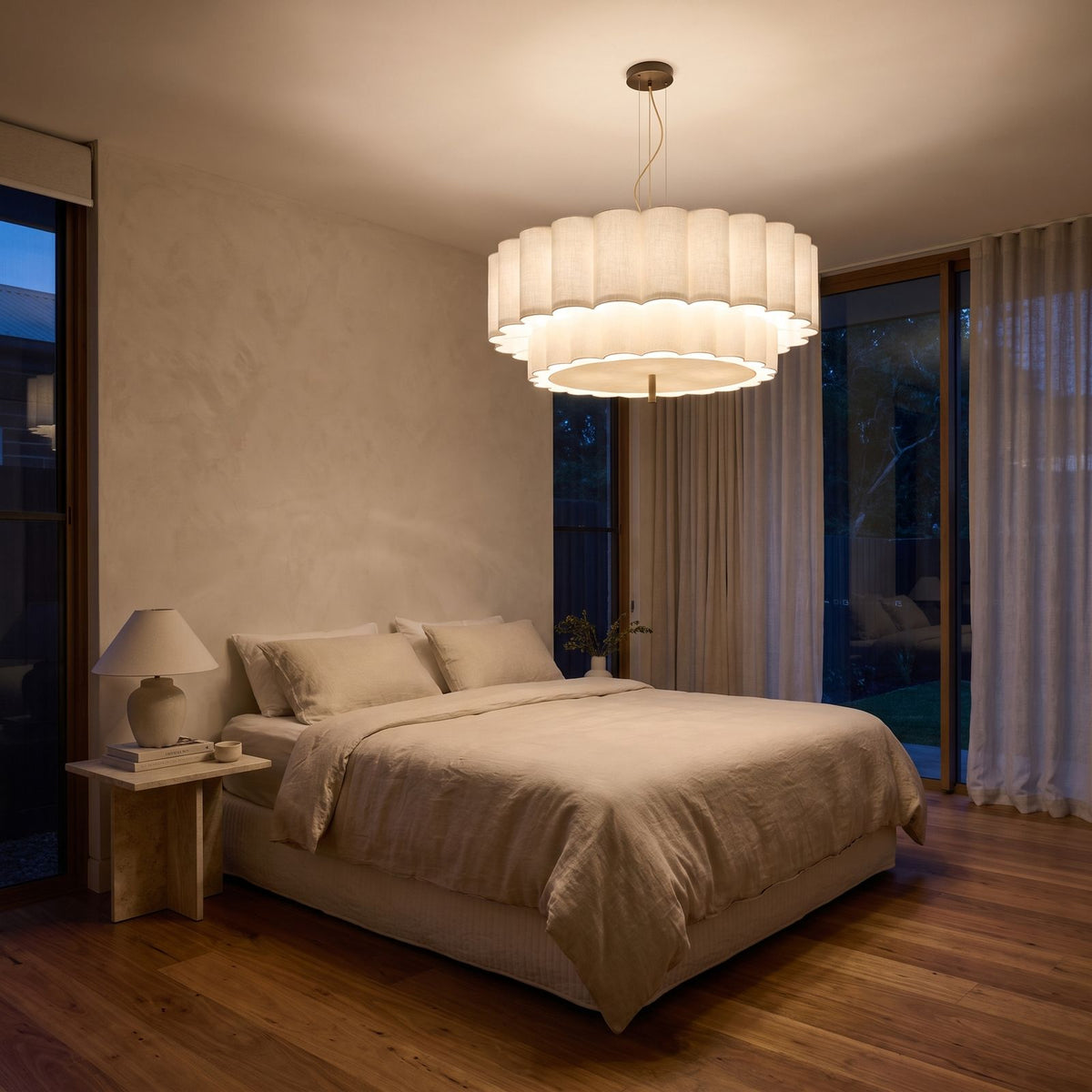 Boho Knitted Fabric Ripple Pendant Light centred above a bed