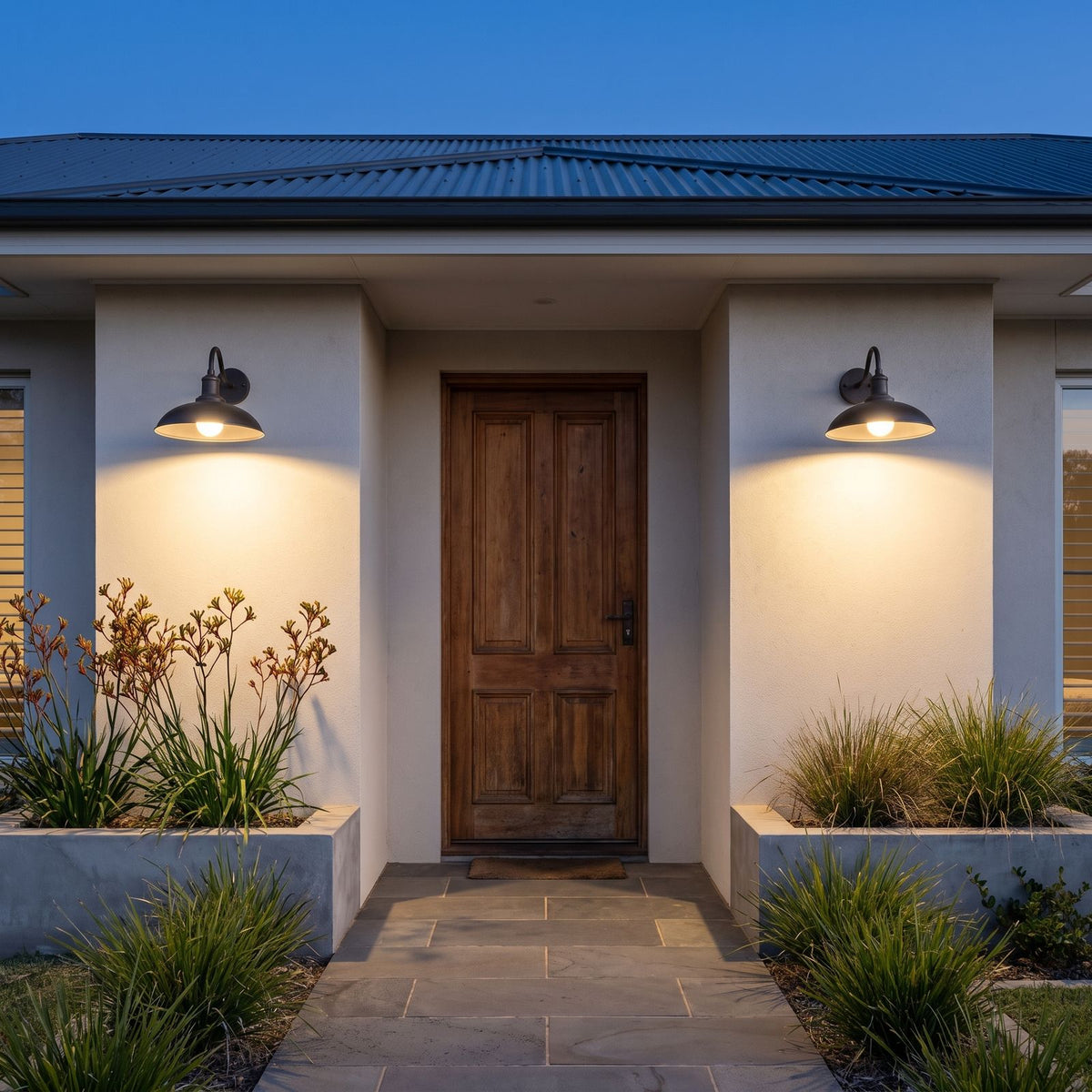A pair of Bowl Shade Gooseneck Outdoor Wall Lights either side of a timber front door