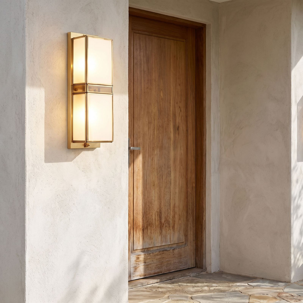 Brass and White Glass Outdoor Wall Light beside a timber front door