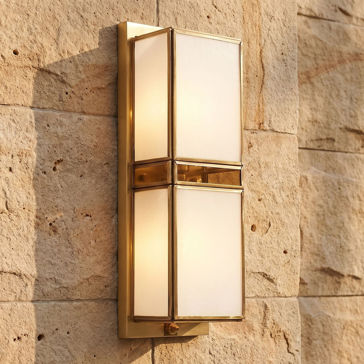 Brass and White Glass Outdoor Wall Light, close view at 45 degrees on a stone wall