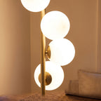 Close-up of the opal glass globes on the brass finish pole