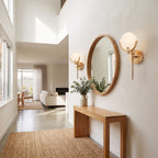 Brass Rod Alabaster Globe Wall Light in a pair on a wall of an Australian home