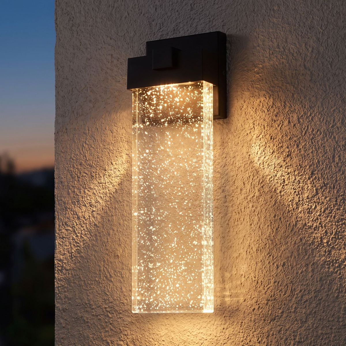 Bubble Acrylic Column Outdoor Wall Light on a porch wall at dusk