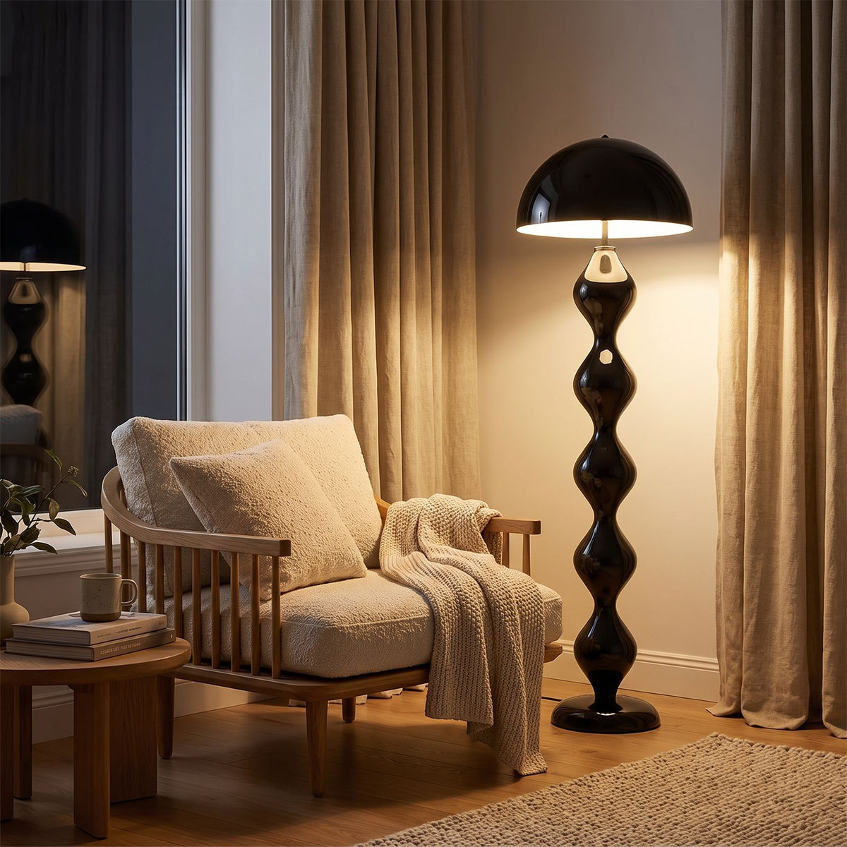 Black mushroom floor lamp beside an oak armchair in a living room reading corner at night