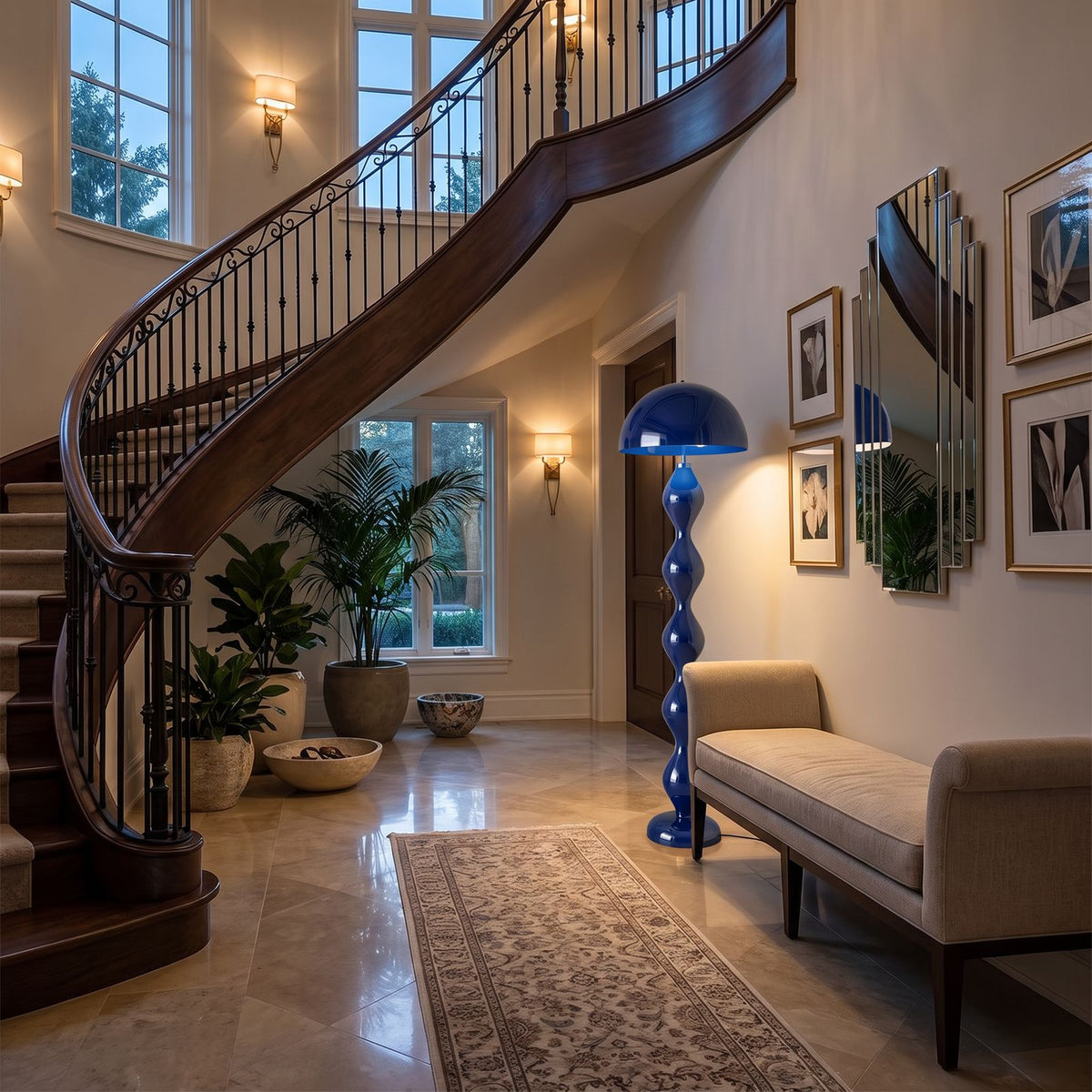 Blue mushroom floor lamp beside a bench in an entry hall with a curved staircase