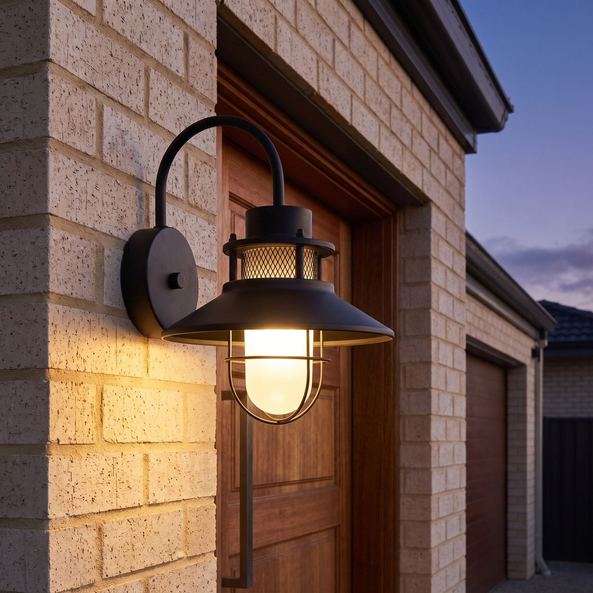 Caged Frosted Glass Gooseneck Outdoor Wall Light beside a timber front door at dusk