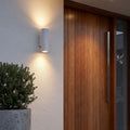 Cement and Acrylic Outdoor Wall Light beside a timber front door on a rendered wall