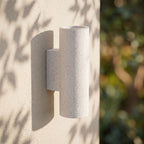 Cement and Acrylic Outdoor Wall Light on a rendered wall, angled close view