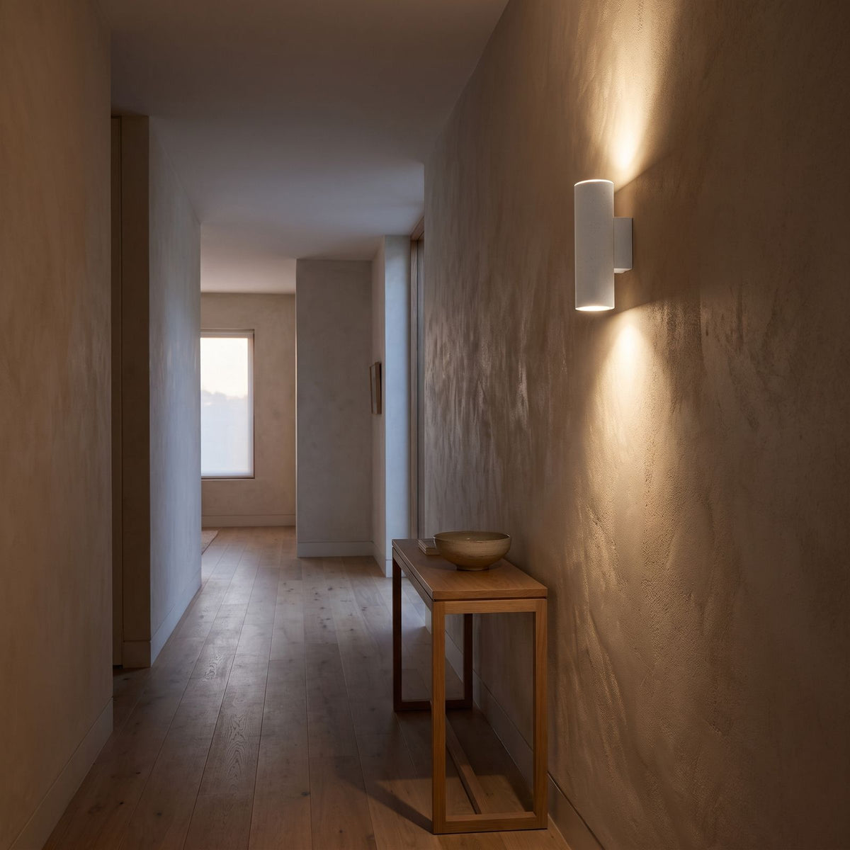 Cement and Acrylic Outdoor Wall Light on a rendered wall in an entry hallway