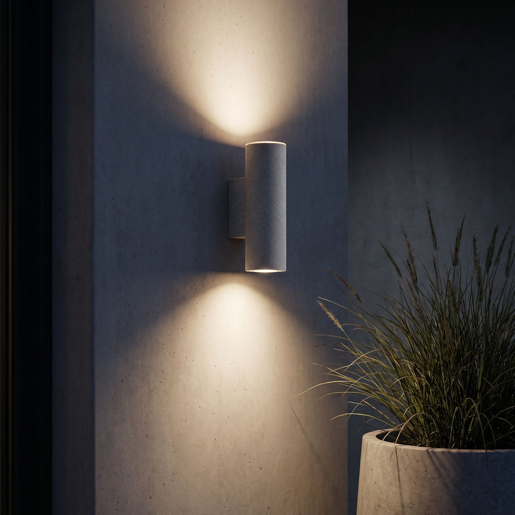 Cement and Acrylic Outdoor Wall Light lighting a dark rendered wall at night