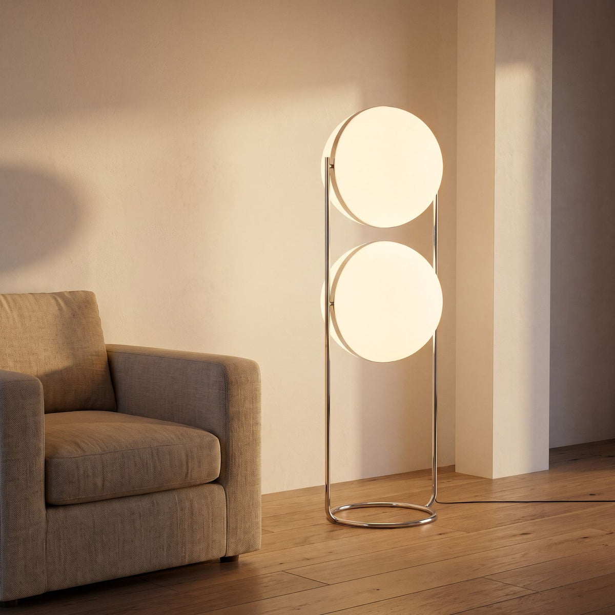 Chrome Ring Acrylic Double Globe Floor Lamp beside an armchair in a living room corner