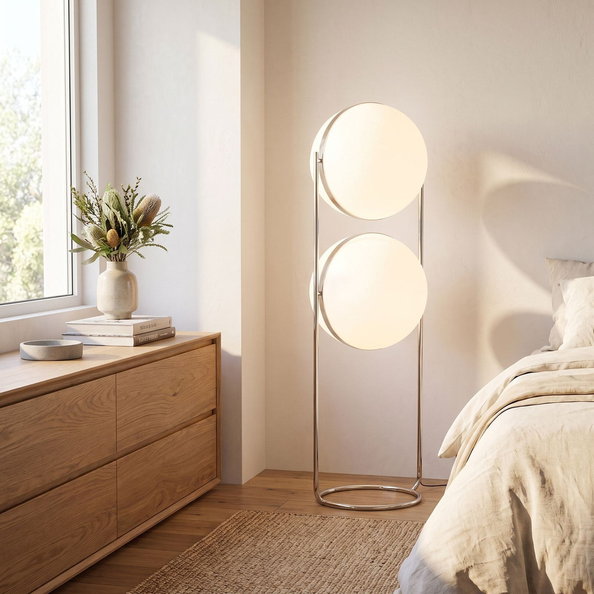 Chrome ring double globe floor lamp in a bedroom corner in daylight