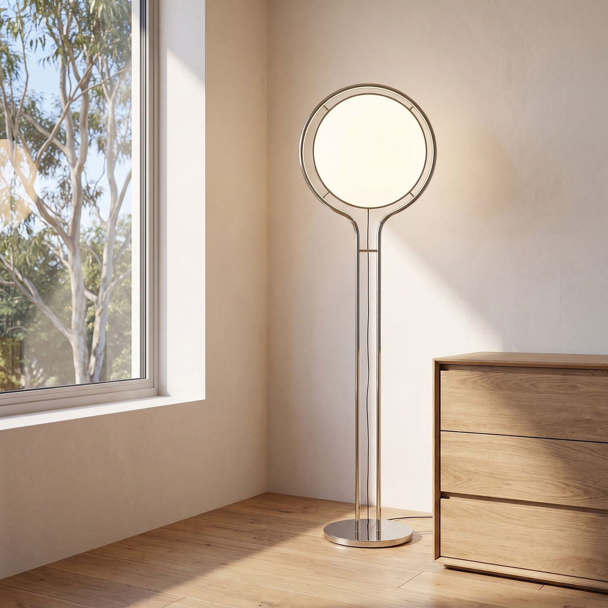 Chrome ring acrylic globe floor lamp in a bedroom corner in daylight