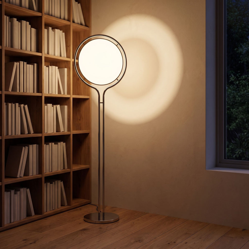 Chrome ring acrylic globe floor lamp in a reading corner at night