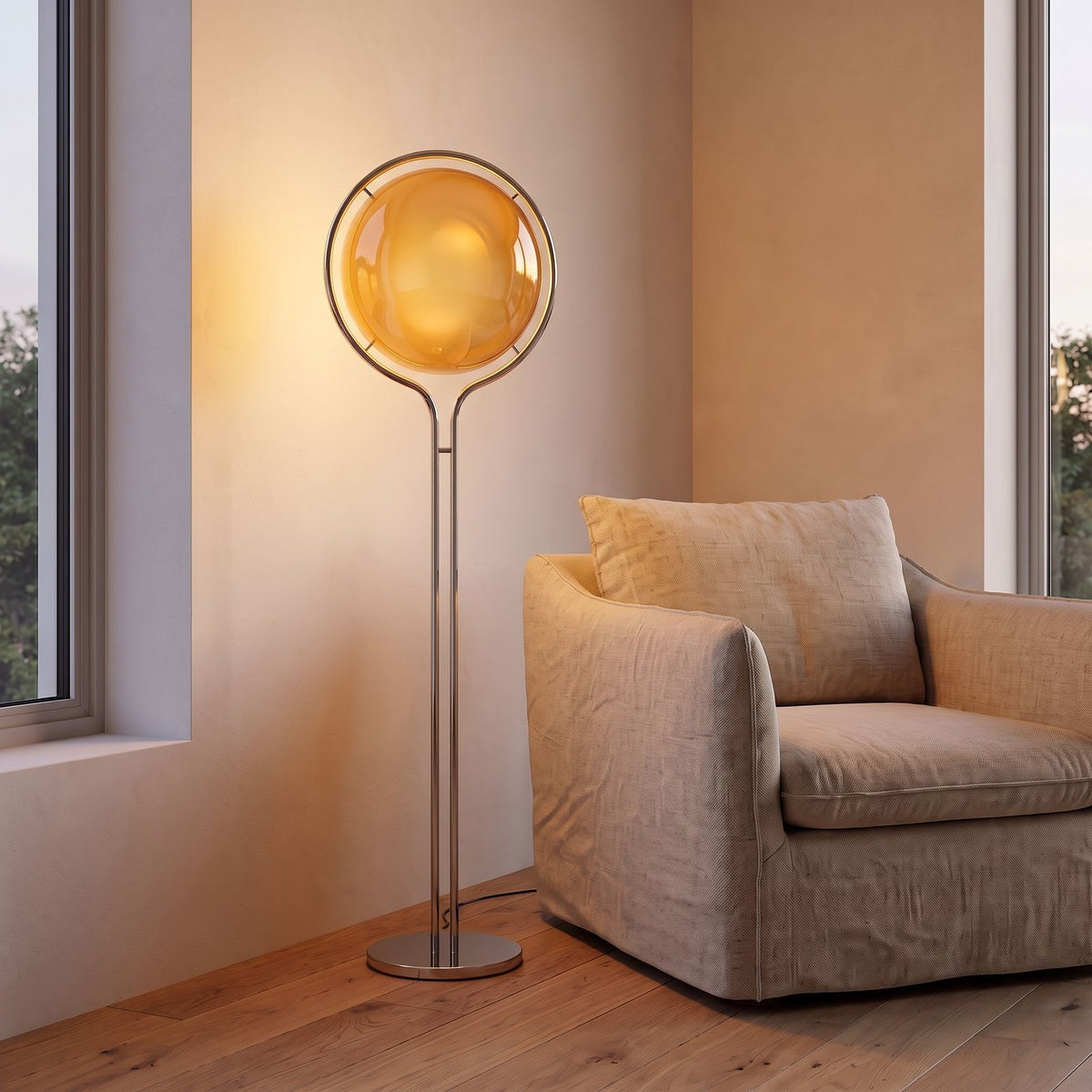 Chrome Ring Acrylic Globe Floor Lamp with an amber shade beside an armchair in a living room corner