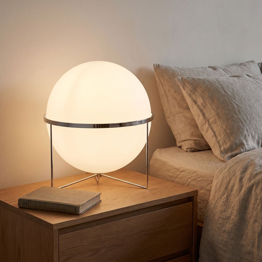 Chrome Ring Acrylic Globe Table Lamp on a bedside table