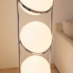 Close-up of the chrome rings around the three stacked globes