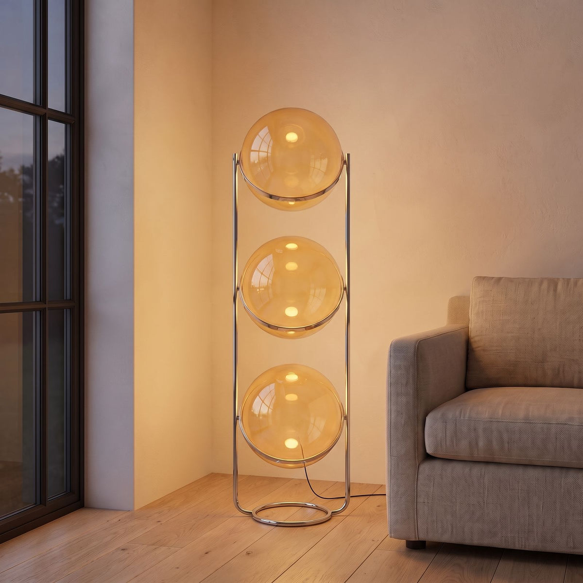 Chrome Ring Acrylic Triple Globe Floor Lamp with amber shades beside an armchair in a living room corner