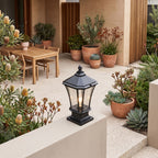 Classic Octagonal Glass Lantern Solar Post Light on a courtyard terrace pillar in daylight