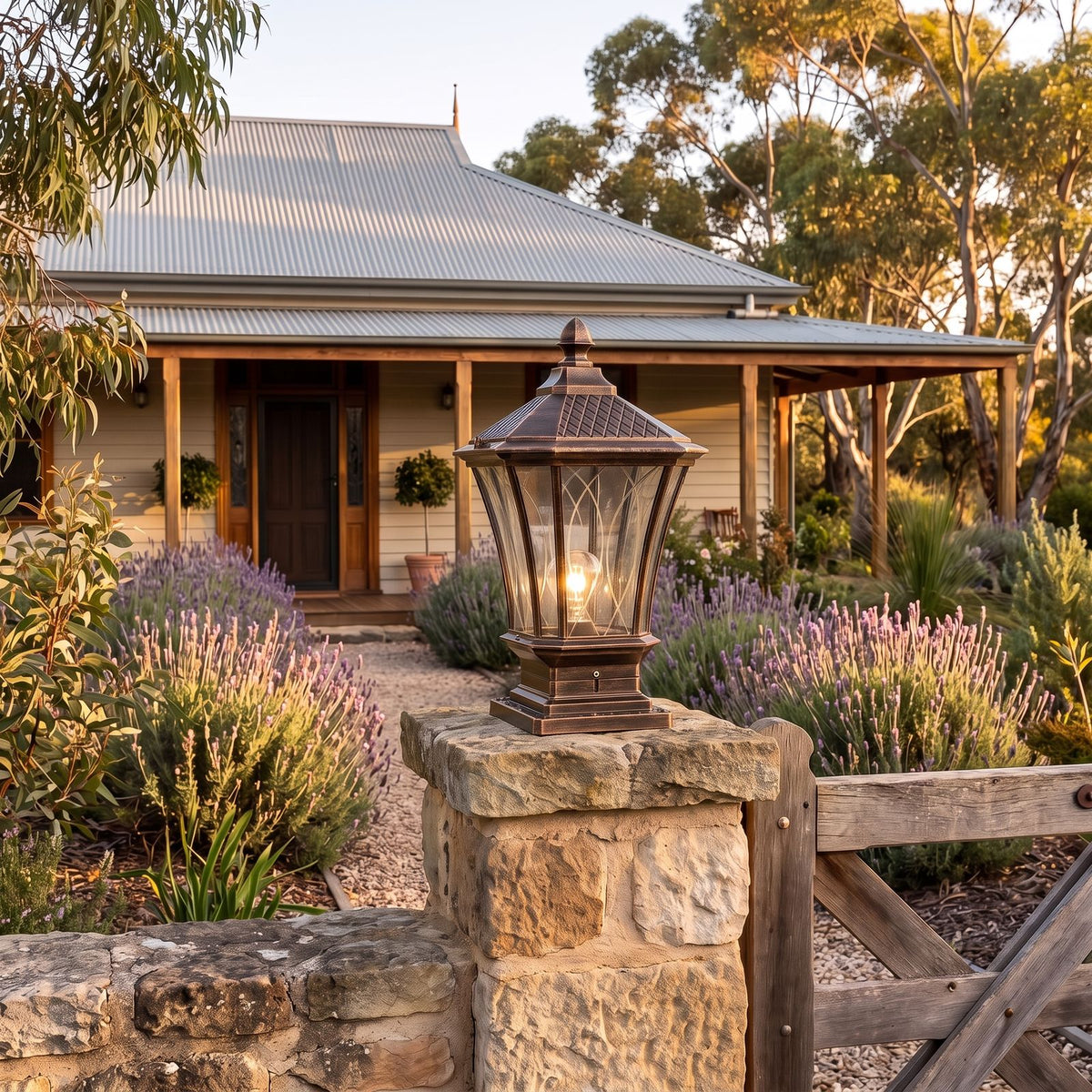 Classic Octagonal Glass Lantern Solar Post Light in antique bronze on a limestone pillar at dusk