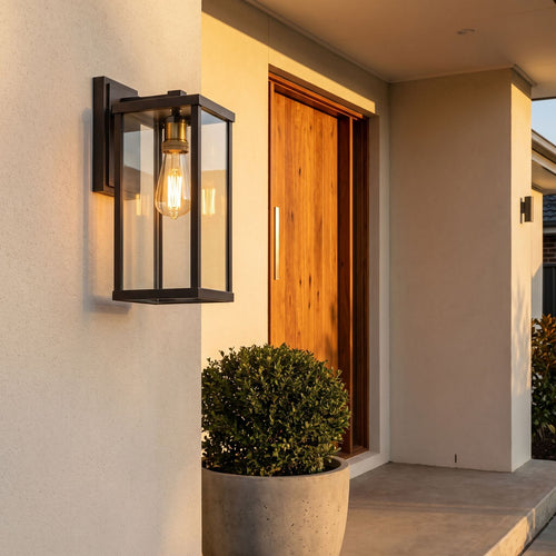 Clear Glass Lantern Outdoor Wall Light beside a timber front door