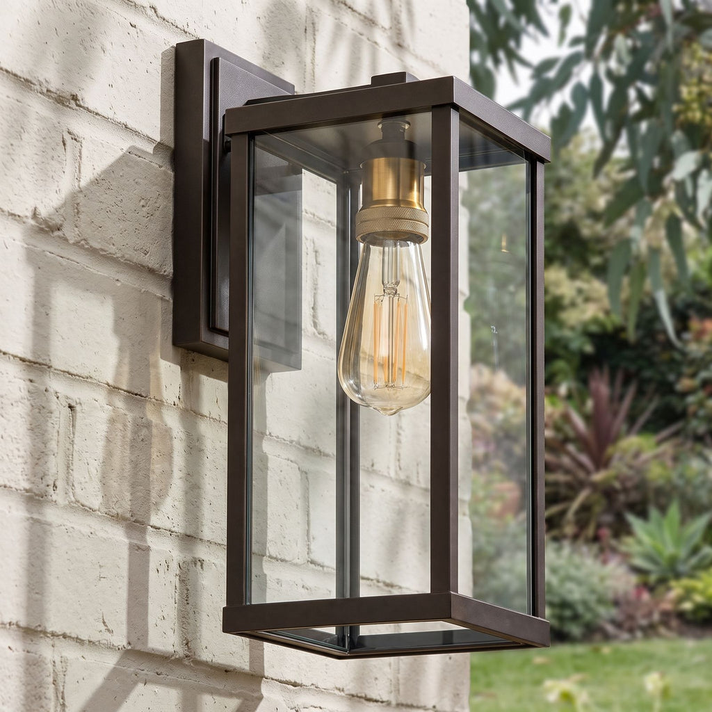 Clear Glass Lantern Outdoor Wall Light on a brick wall, angled close view