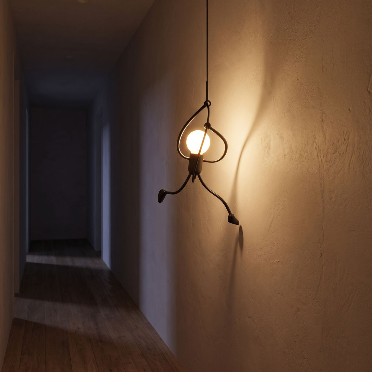 Climbing figure iron pendant light in a hallway at night
