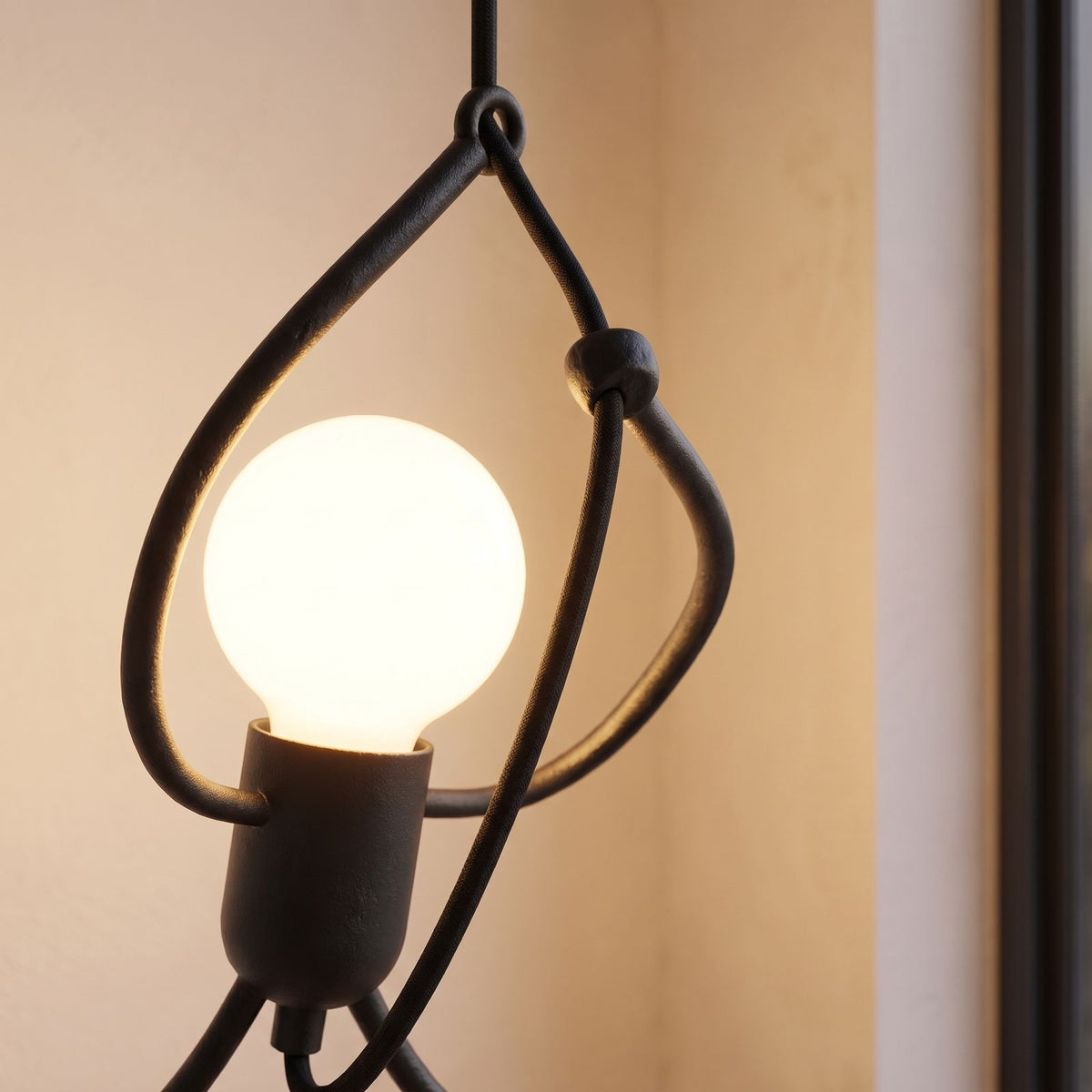 Close-up of the iron figure and bulb