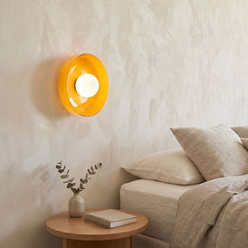 Coloured Glass Dish Opal Globe Wall and Ceiling Light beside a bed