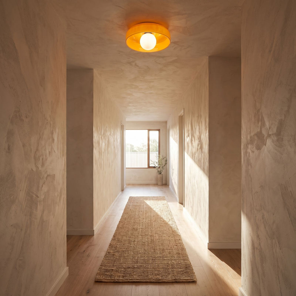 Coloured glass dish wall and ceiling light on a hallway ceiling, wide view