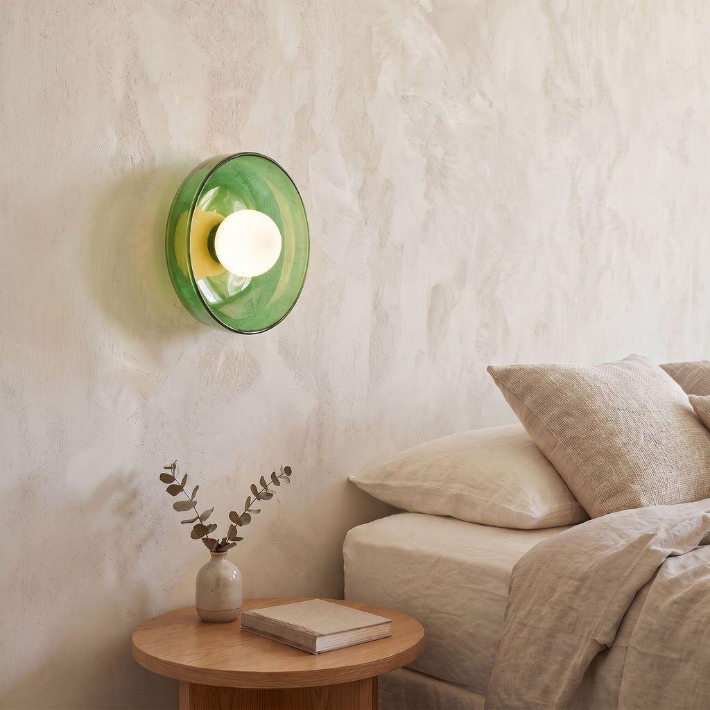 Coloured Glass Dish Opal Globe Wall and Ceiling Light in green glass beside a bed