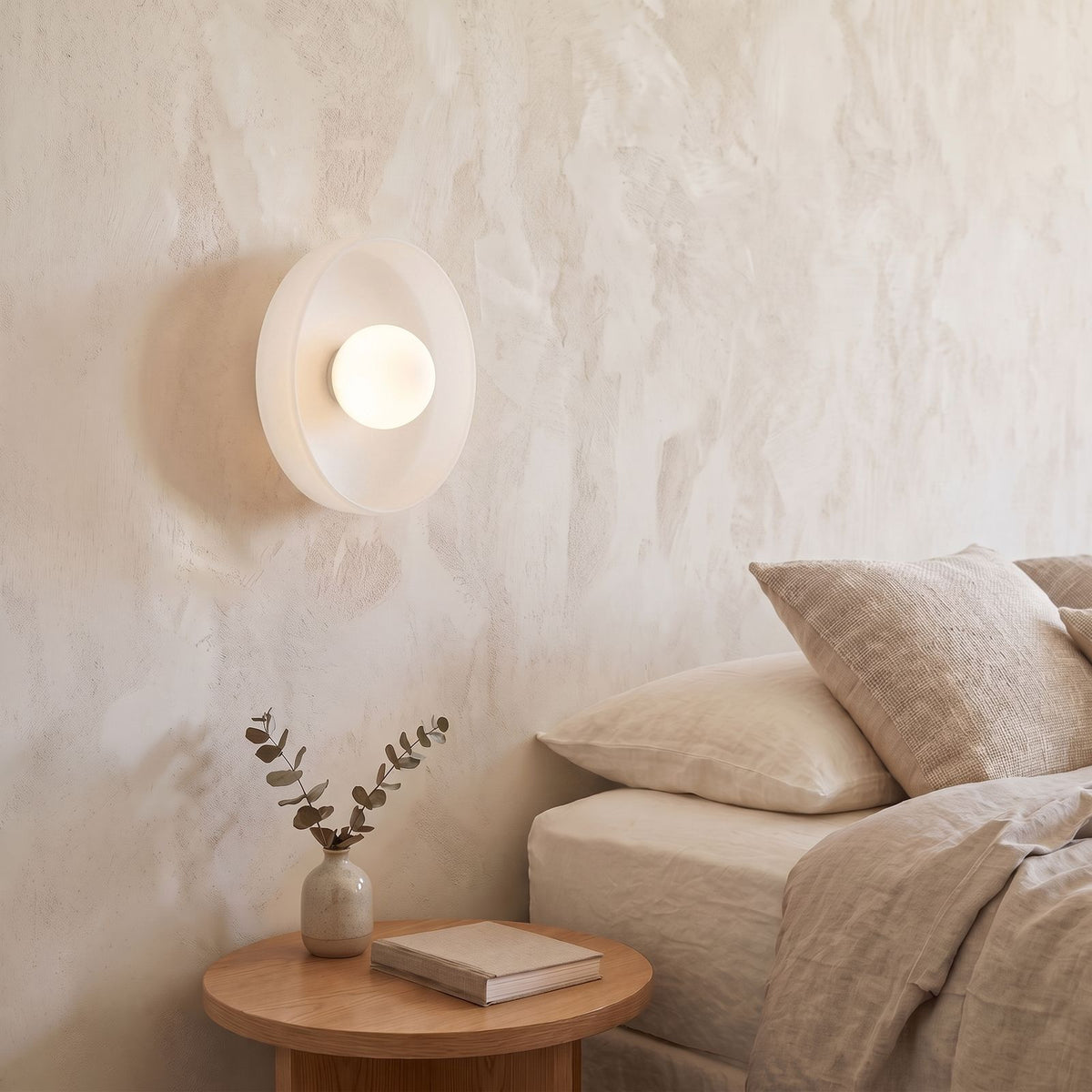 Coloured Glass Dish Opal Globe Wall and Ceiling Light in white glass beside a bed