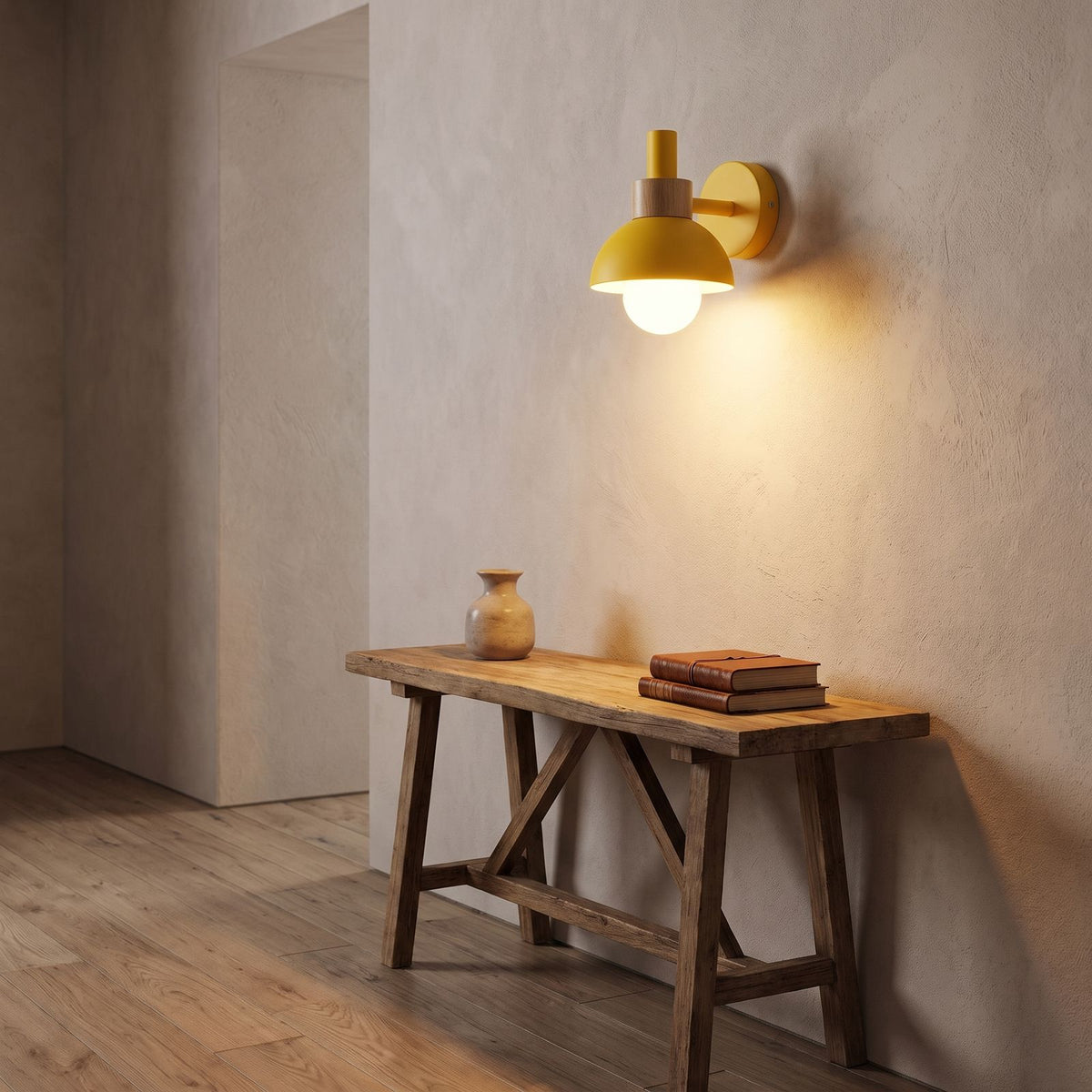 Coloured Matte Iron Cylinder Wall Light in a hallway above a timber console