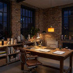 Colourful Two-Tone Glass Drum Pendant Light in orange glass above a timber desk in a home office studio at night