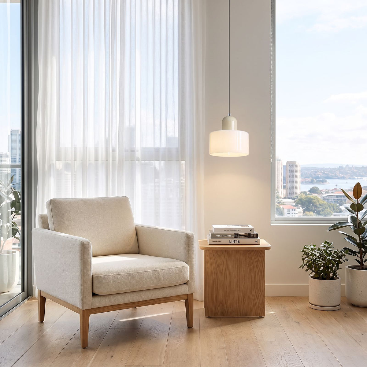 Colourful Two-Tone Glass Drum Pendant Light in white glass with a beige cap above a side table beside an armchair in a living room reading corner