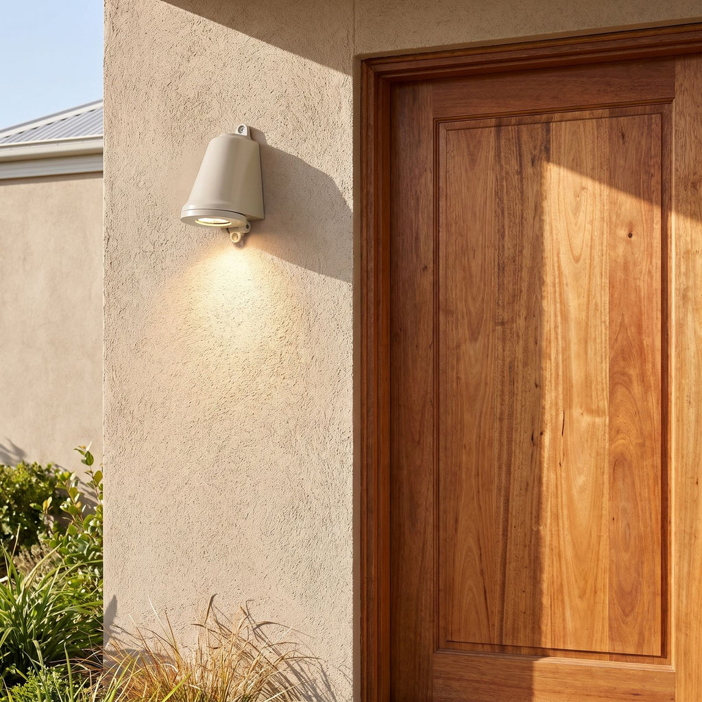 Compact Aluminium LED Outdoor Wall Light beside a timber front door