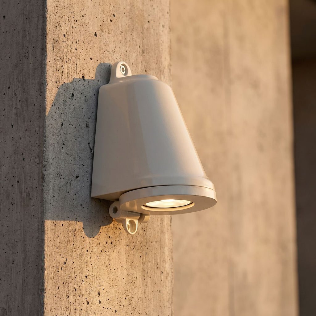 Compact Aluminium LED Outdoor Wall Light, close view at 45 degrees on a stone wall