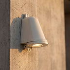 Compact Aluminium LED Outdoor Wall Light, close view at 45 degrees on a stone wall