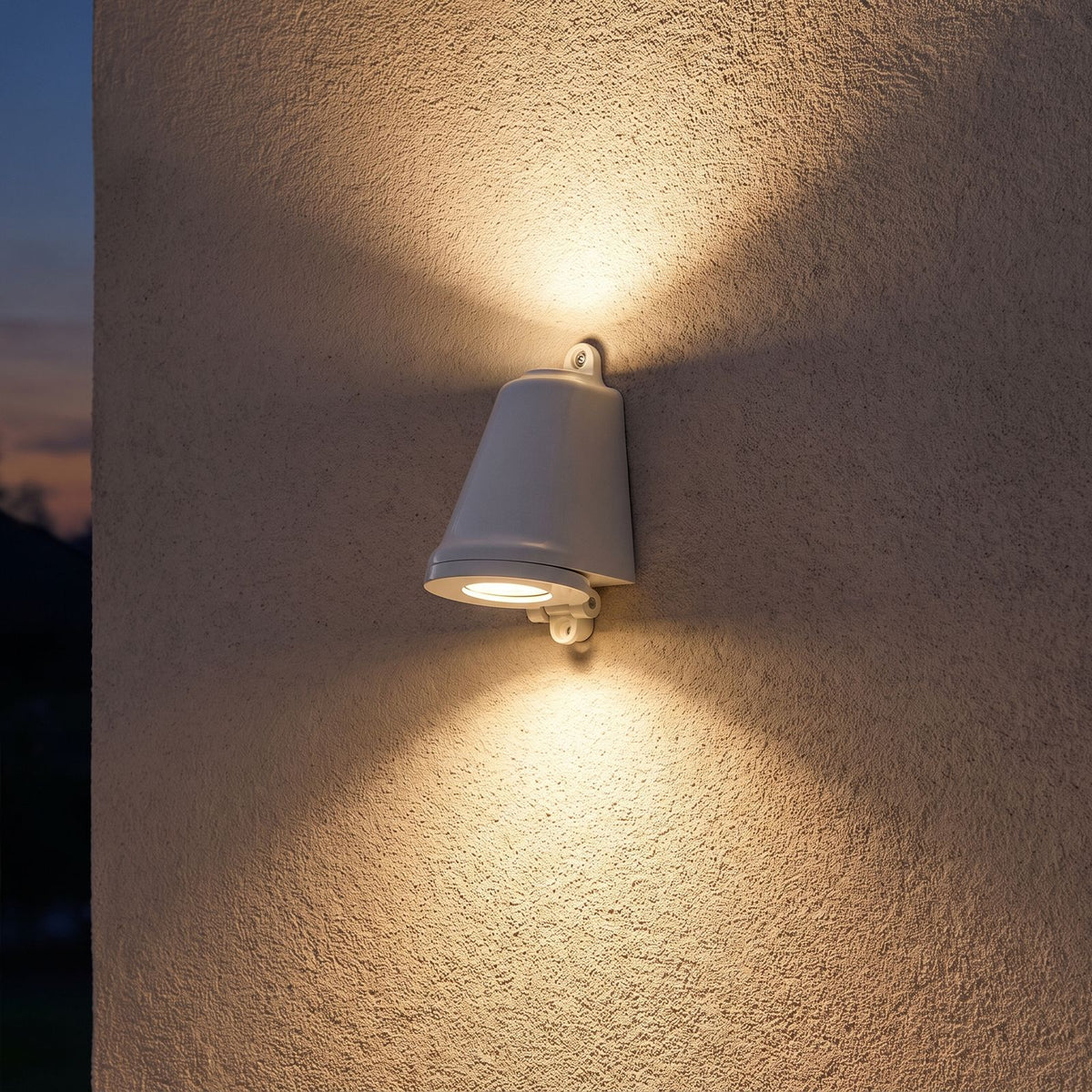 Compact Aluminium LED Outdoor Wall Light on a porch wall at dusk