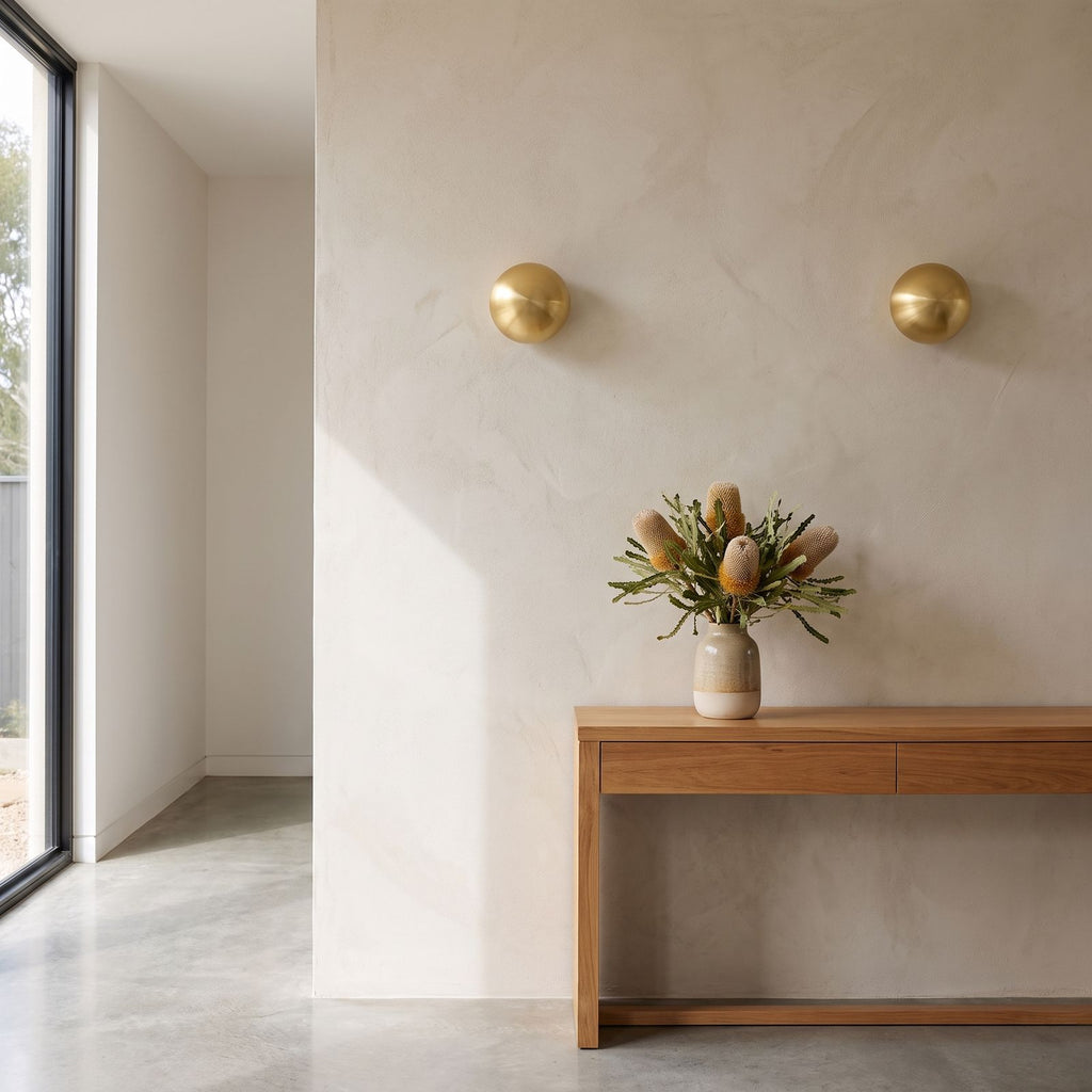 Compact Round Iron LED Wall Light in a pair on a wall of an Australian home