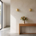 Compact Round Iron LED Wall Light in a pair on a wall of an Australian home